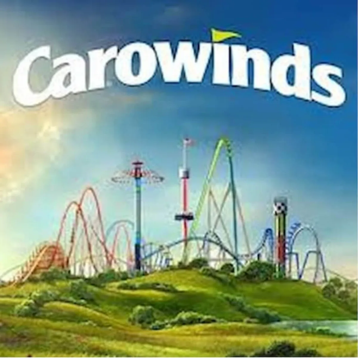 A lively shot of an amusement park with roller coasters, green hills, and a bright blue sky, radiating excitement and the potential for group fun and adventure beyond the homes themselves.